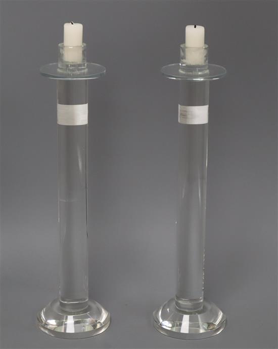 A pair of modern glass candlesticks height 36cm